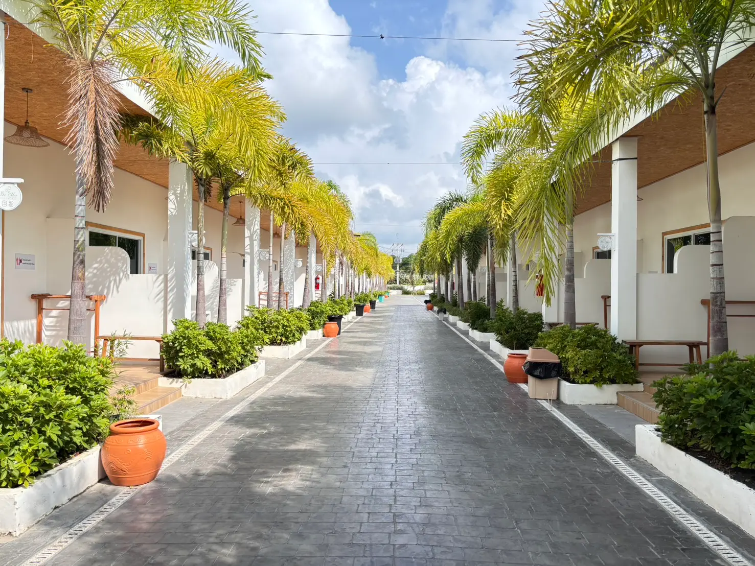 De Mer Resort street looking down at a row of bungalows